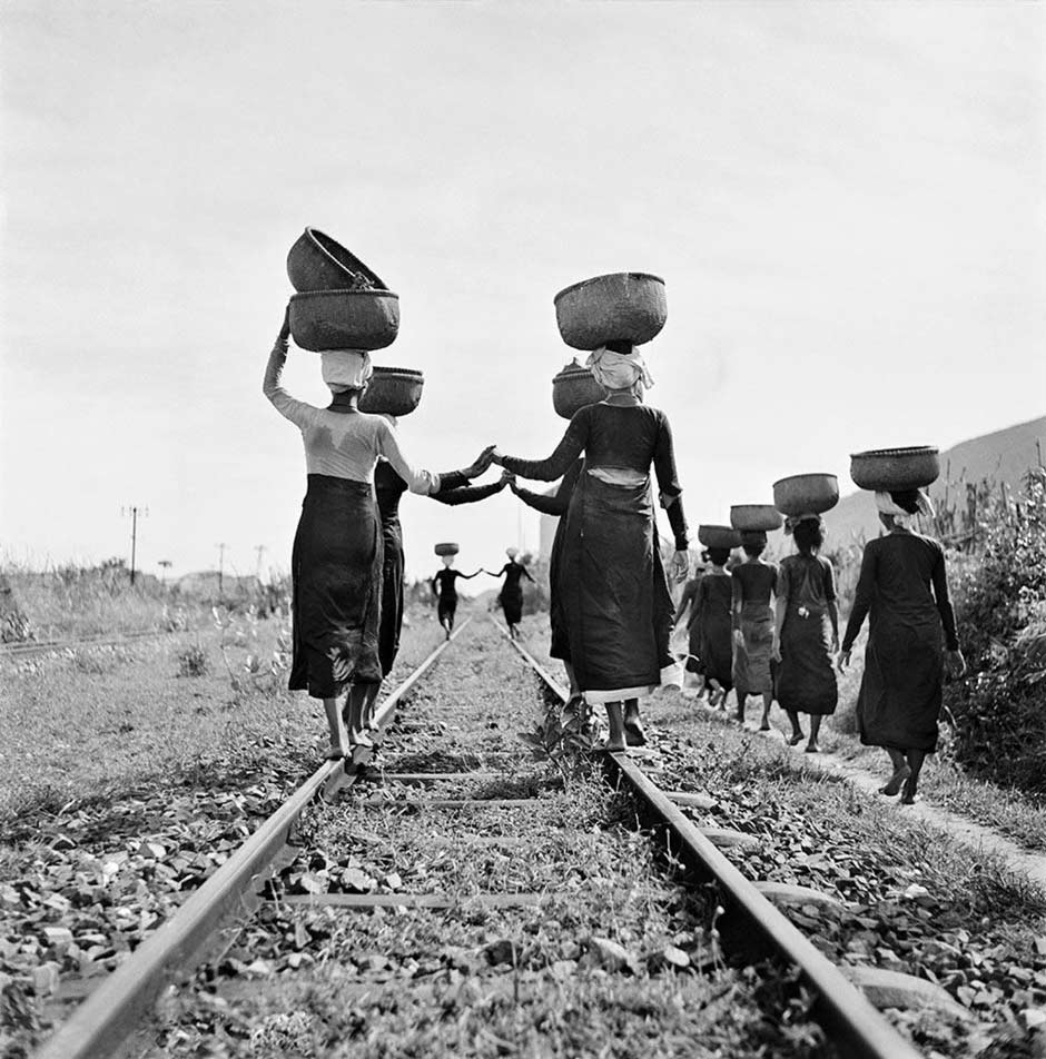 Description: Eastern Cham women returning from the market at Barau