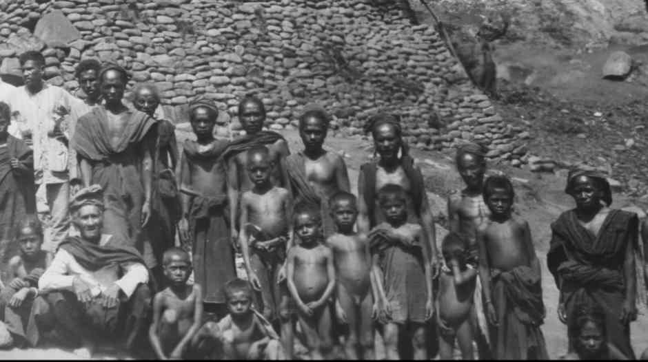 Description: Men and boys at Wolotopo