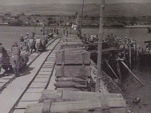 Description: Japanese stores being moved onto barges at Waingapu 1945